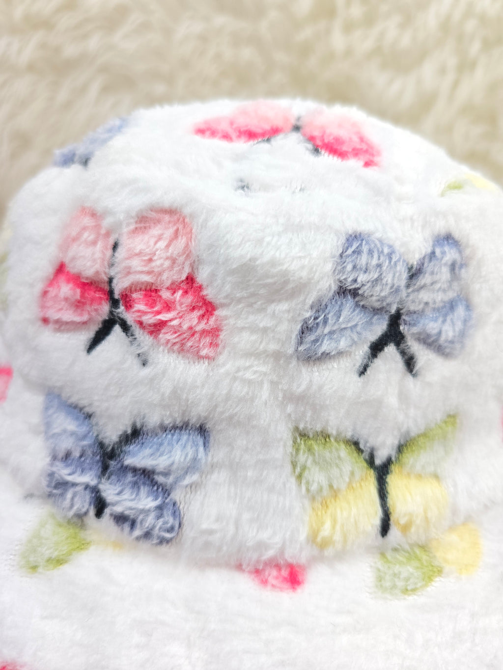 The White Butterfly Fuzzy Bucket Hat